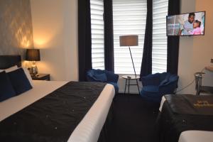 Ένα ή περισσότερα κρεβάτια σε δωμάτιο στο Sunnyside Guest House Southport