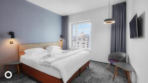 Postel nebo postele na pokoji v ubytování Midgardur by Center Hotels
