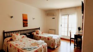 Hotel Baixamar tesisinde bir odada yatak veya yataklar