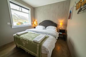 Rúm í herbergi á Hotel Siglunes