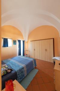 a bedroom with a bed in a room at Residenza delle Palme in Pantelleria