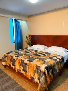 Postel nebo postele na pokoji v ubytování Hotel Esencia Suites