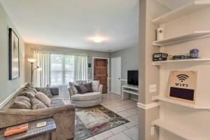 a living room with a couch and a tv at Pet-Friendly Brunswick Retreat with Gas Grill! in Brunswick