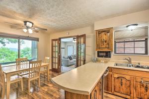 a kitchen and dining room with a table and chairs at Idyllic Bronston Retreat with Fire Pit and View! in Burnside