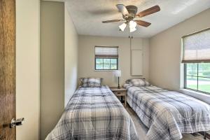 A bed or beds in a room at Idyllic Bronston Retreat with Fire Pit and View!