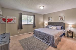 A bed or beds in a room at Lovely Twin Falls Home with Private Hot Tub!