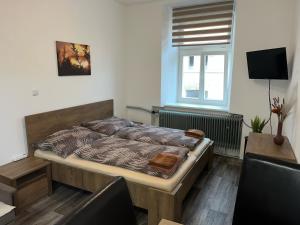 Postelja oz. postelje v sobi nastanitve Apartmány Nežárka a privátní wellness