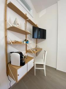 TV a/nebo společenská místnost v ubytování Il Timone B&B