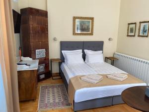 Una cama o camas en una habitación de Apartman Centar
