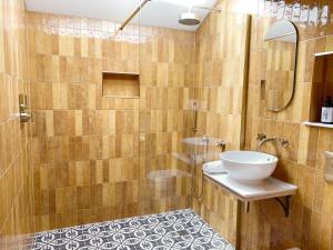 a bathroom with a sink and a shower at Luxury bolthole in central St.Agnes with parking. in St. Agnes