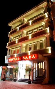 a hotel with a hotel sale sign in front of it at Hotel Sara & SPA in Pristina