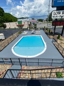 a large swimming pool in a parking lot at Bear Mount Inn & Suites in Pigeon Forge