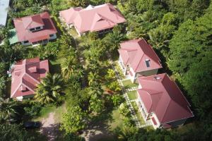an overhead view of a resort with pink roofs at Villa Rafia in Baie Sainte Anne