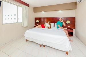 Postel nebo postele na pokoji v ubytování Hotel Maria del Carmen