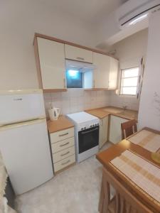Kuchyňa alebo kuchynka v ubytovaní Kali View Apartment