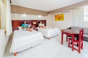 Postel nebo postele na pokoji v ubytování Hotel Maria del Carmen