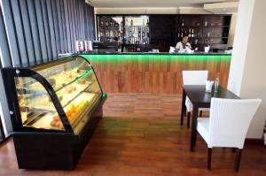 A área de bar ou lounge em Novo Turismo Resort & Spa