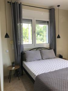 Posteľ alebo postele v izbe v ubytovaní georgia's cozy rooms #3