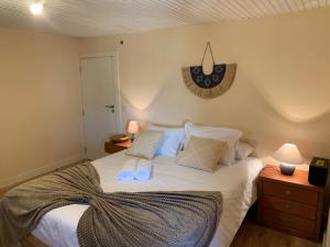Ein Bett oder Betten in einem Zimmer der Unterkunft Villa Candoso