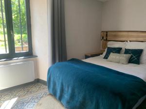 Posteľ alebo postele v izbe v ubytovaní Gîte de la Couze pavin
