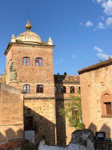 a large brick building with a dome on top at LA CALLEJINA Cáceres Full equipped HOUSE AT CC-00616 in Cáceres