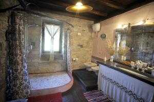 a bathroom with a shower and a toilet and a sink at chevalier claudio in Agnone
