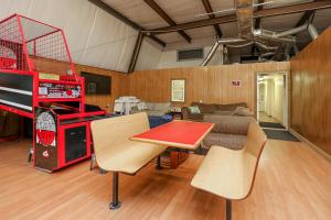 a living room with a table and a couch at Spacious Home with Waterfront View-Welcome Pets in Sneads Ferry