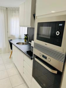 Kuchyň nebo kuchyňský kout v ubytování Apartamento Sant Roc