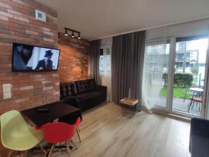 Televízia a/alebo spoločenská miestnosť v ubytovaní Loft House