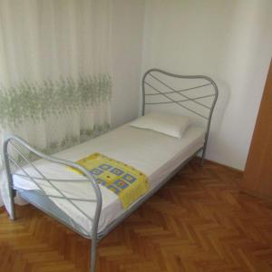 Postel nebo postele na pokoji v ubytování Apartmani Zora