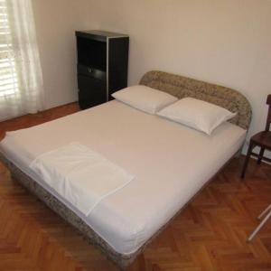 Postel nebo postele na pokoji v ubytování Apartmani Zora
