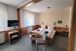 Ένα ή περισσότερα κρεβάτια σε δωμάτιο στο Haus Hesseberg