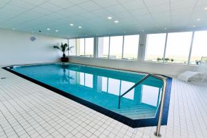 a large swimming pool in a large building at Am Sahlenburger Strand AS11 in Cuxhaven