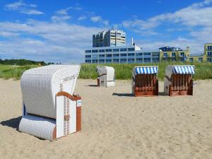a group of chairs sitting on the beach at Am Sahlenburger Strand AS11 in Cuxhaven