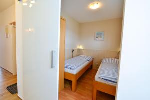 Llit o llits en una habitació de Am Sahlenburger Strand AS12 19 fotos més