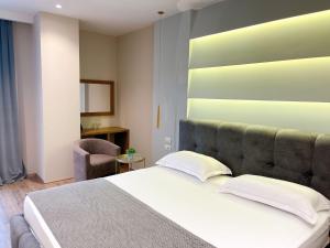 Postel nebo postele na pokoji v ubytování Light Hotel