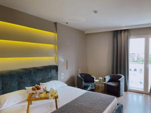 Postel nebo postele na pokoji v ubytování Light Hotel