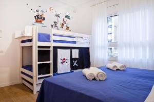 a bedroom with a blue bed and blue walls at Blue Barcelona in Barcelona