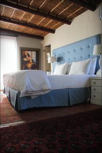 Tempat tidur dalam kamar di Klokkiebosch Guesthouse