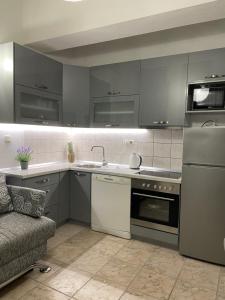 Kuchyň nebo kuchyňský kout v ubytování Apartmani Marić