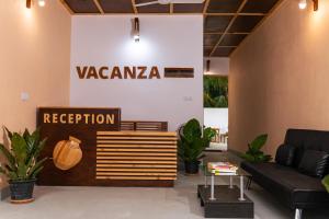 a living room with a couch and a sign at Vacanza Mathiveri in Mathiveri
