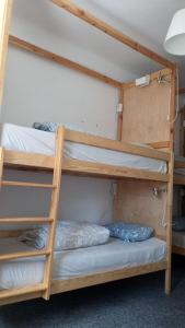 two bunk beds in a dorm room with at For rest Hostel in Lublin