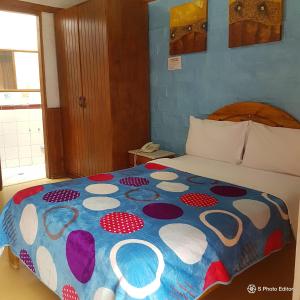 Postel nebo postele na pokoji v ubytování Hostal La Catolica