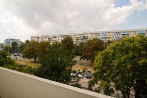a view of a parking lot with a building at Chayka Comfort Apartment in Varna City