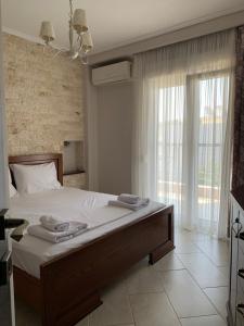 Ένα ή περισσότερα κρεβάτια σε δωμάτιο στο Pearl House Skg