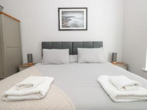 Säng eller sängar i ett rum på Flat 1 Byfield
