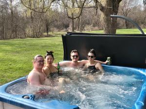 a group of people in a jacuzzi tub at Nature Oasis Bar Room in Dundas