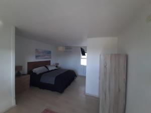 Postel nebo postele na pokoji v ubytování Hotel Trocadero