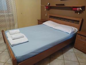 A bed or beds in a room at Island house in Elika - Marathias