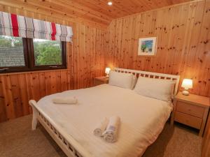 מיטה או מיטות בחדר ב-Lodge 16